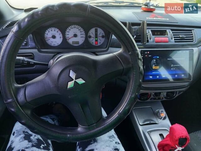 Черный Мицубиси Лансер, объемом двигателя 1.6 л и пробегом 320 тыс. км за 4500 $, фото 8 на Automoto.ua