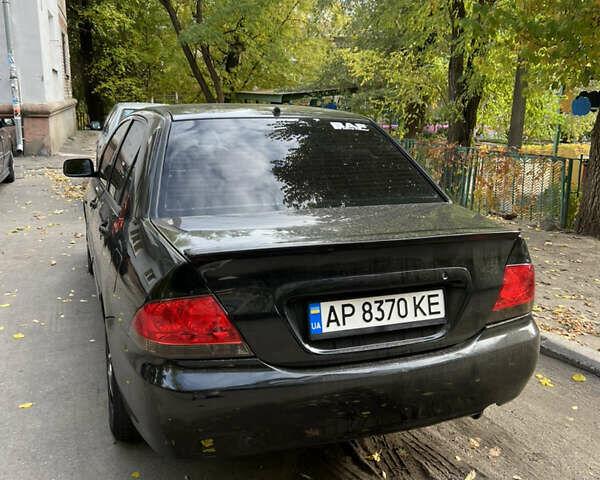 Чорний Міцубісі Lancer, об'ємом двигуна 1.58 л та пробігом 234 тис. км за 3800 $, фото 1 на Automoto.ua