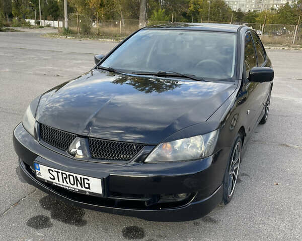 Чорний Міцубісі Lancer, об'ємом двигуна 2 л та пробігом 280 тис. км за 4600 $, фото 2 на Automoto.ua