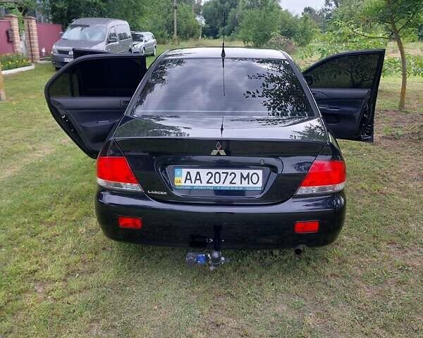 Черный Мицубиси Лансер, объемом двигателя 1.6 л и пробегом 210 тыс. км за 5500 $, фото 5 на Automoto.ua