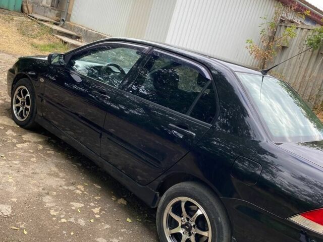 Чорний Міцубісі Lancer, об'ємом двигуна 1.6 л та пробігом 232 тис. км за 4200 $, фото 6 на Automoto.ua
