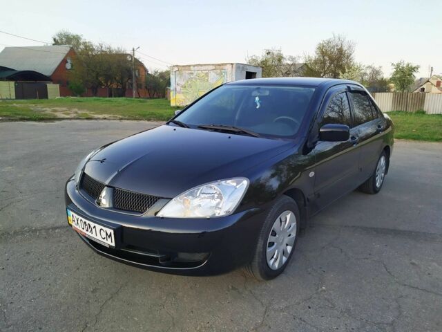 Черный Мицубиси Лансер, объемом двигателя 1.6 л и пробегом 32 тыс. км за 9000 $, фото 4 на Automoto.ua