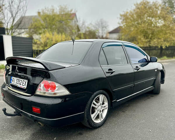 Черный Мицубиси Лансер, объемом двигателя 2 л и пробегом 260 тыс. км за 5300 $, фото 3 на Automoto.ua