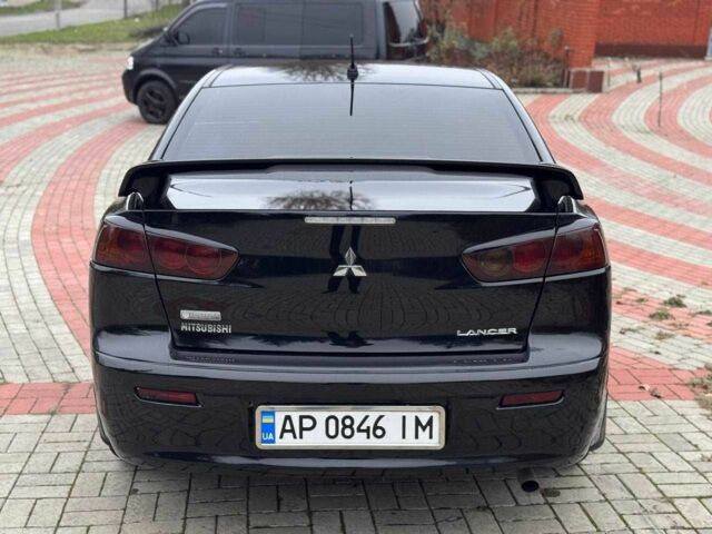 Черный Мицубиси Лансер, объемом двигателя 2 л и пробегом 217 тыс. км за 5500 $, фото 6 на Automoto.ua