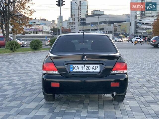 Чорний Міцубісі Lancer, об'ємом двигуна 1.58 л та пробігом 237 тис. км за 4300 $, фото 3 на Automoto.ua