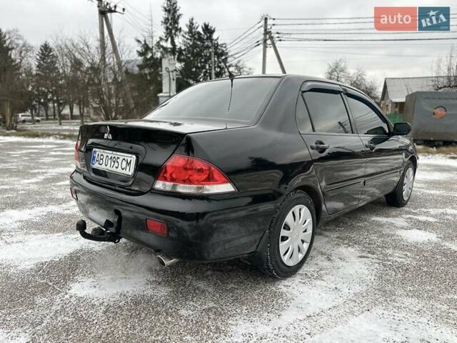 Чорний Міцубісі Lancer, об'ємом двигуна 1.6 л та пробігом 160 тис. км за 4600 $, фото 29 на Automoto.ua