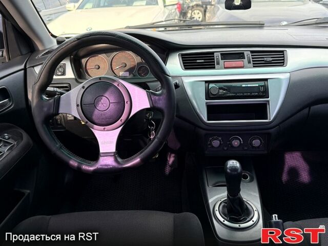 Черный Мицубиси Лансер, объемом двигателя 1.6 л и пробегом 260 тыс. км за 3700 $, фото 6 на Automoto.ua