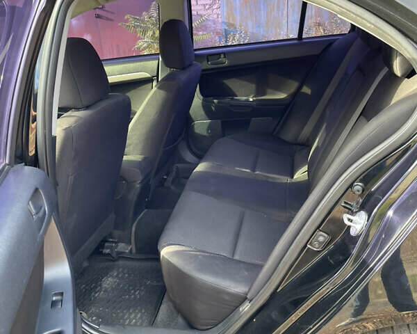 Чорний Міцубісі Lancer, об'ємом двигуна 1.5 л та пробігом 150 тис. км за 6500 $, фото 11 на Automoto.ua