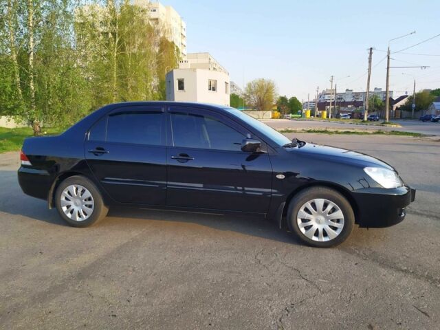 Черный Мицубиси Лансер, объемом двигателя 1.6 л и пробегом 32 тыс. км за 9000 $, фото 11 на Automoto.ua