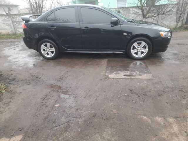 Черный Мицубиси Лансер, объемом двигателя 2 л и пробегом 215 тыс. км за 5700 $, фото 3 на Automoto.ua