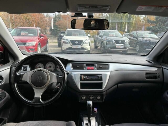 Мицубиси Лансер 2007 в Кривом Роге на Automoto.ua Черный Мицубиси Лансер, объемом двигателя 2 л и пробегом 143 тыс. км за 5400 $, фото 8 на Automoto.ua