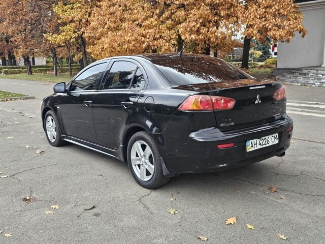 Черный Мицубиси Лансер, объемом двигателя 2 л и пробегом 115 тыс. км за 5000 $, фото 5 на Automoto.ua