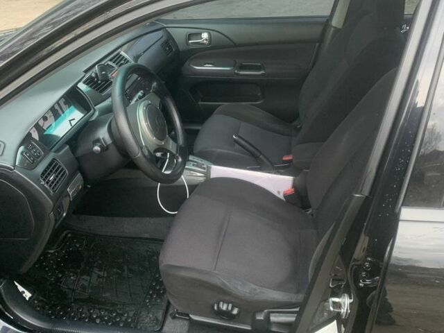 Черный Мицубиси Лансер, объемом двигателя 2 л и пробегом 240 тыс. км за 5600 $, фото 1 на Automoto.ua