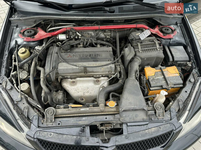Чорний Міцубісі Lancer, об'ємом двигуна 2 л та пробігом 275 тис. км за 5300 $, фото 53 на Automoto.ua