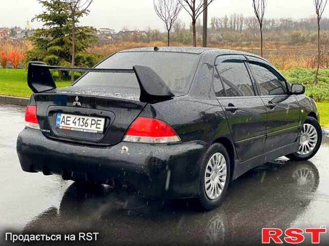 Чорний Міцубісі Lancer, об'ємом двигуна 1.6 л та пробігом 196 тис. км за 3900 $, фото 2 на Automoto.ua
