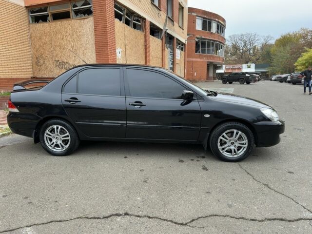 Черный Мицубиси Лансер, объемом двигателя 1.6 л и пробегом 173 тыс. км за 4700 $, фото 5 на Automoto.ua