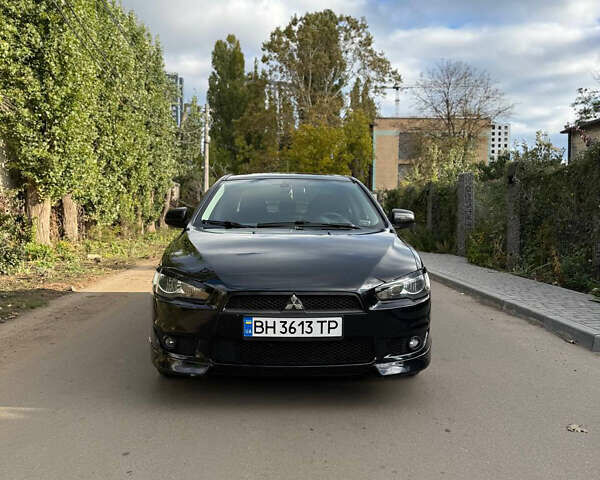 Черный Мицубиси Лансер, объемом двигателя 2 л и пробегом 219 тыс. км за 6400 $, фото 7 на Automoto.ua