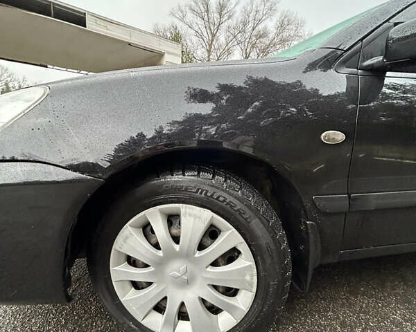 Черный Мицубиси Лансер, объемом двигателя 1.58 л и пробегом 254 тыс. км за 5000 $, фото 12 на Automoto.ua