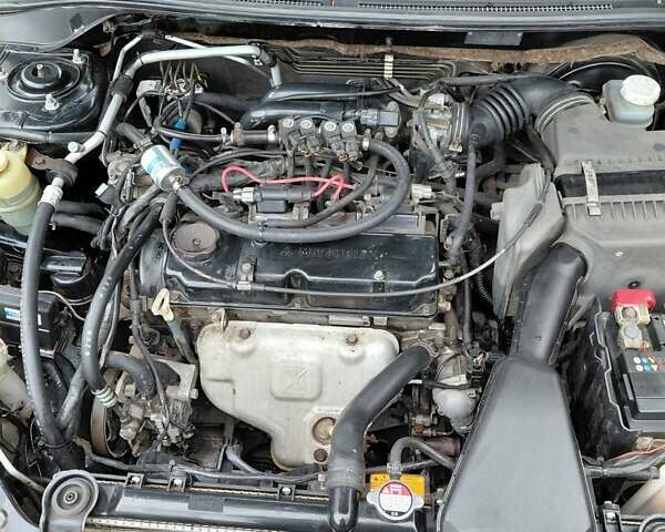 Чорний Міцубісі Lancer, об'ємом двигуна 1.58 л та пробігом 201 тис. км за 4500 $, фото 7 на Automoto.ua