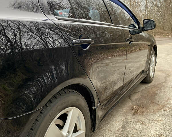 Черный Мицубиси Лансер, объемом двигателя 2 л и пробегом 164 тыс. км за 8300 $, фото 8 на Automoto.ua