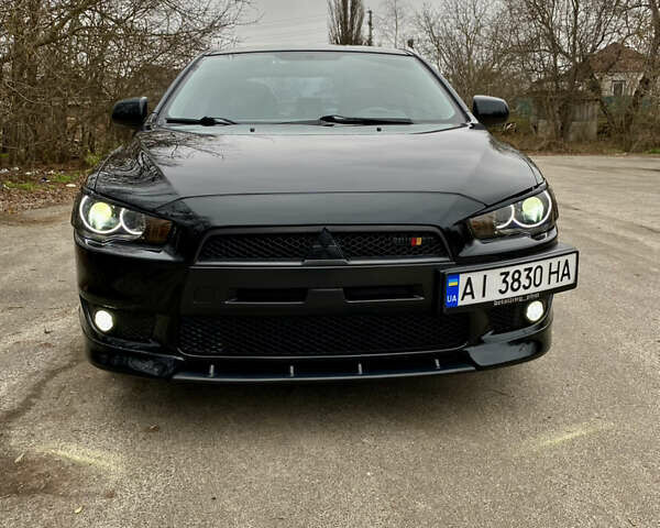 Черный Мицубиси Лансер, объемом двигателя 2 л и пробегом 164 тыс. км за 8300 $, фото 2 на Automoto.ua