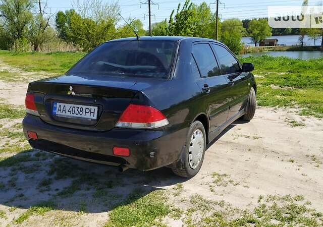 Чорний Міцубісі Lancer, об'ємом двигуна 1.6 л та пробігом 283 тис. км за 3999 $, фото 8 на Automoto.ua