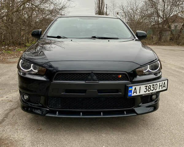 Черный Мицубиси Лансер, объемом двигателя 2 л и пробегом 164 тыс. км за 8300 $, фото 3 на Automoto.ua