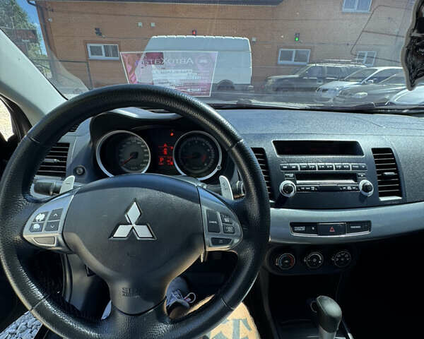 Чорний Міцубісі Lancer, об'ємом двигуна 2 л та пробігом 253 тис. км за 6400 $, фото 11 на Automoto.ua