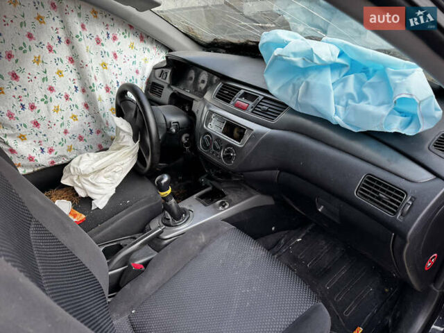 Черный Мицубиси Лансер, объемом двигателя 1.58 л и пробегом 160 тыс. км за 1299 $, фото 1 на Automoto.ua