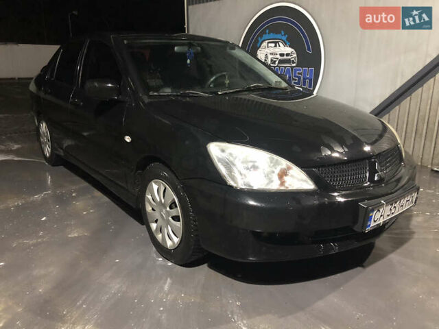 Чорний Міцубісі Lancer, об'ємом двигуна 1.6 л та пробігом 280 тис. км за 3800 $, фото 13 на Automoto.ua