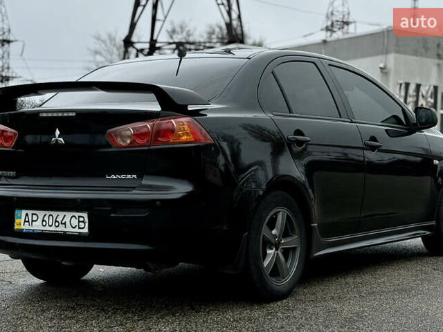 Черный Мицубиси Лансер, объемом двигателя 2 л и пробегом 215 тыс. км за 5500 $, фото 7 на Automoto.ua