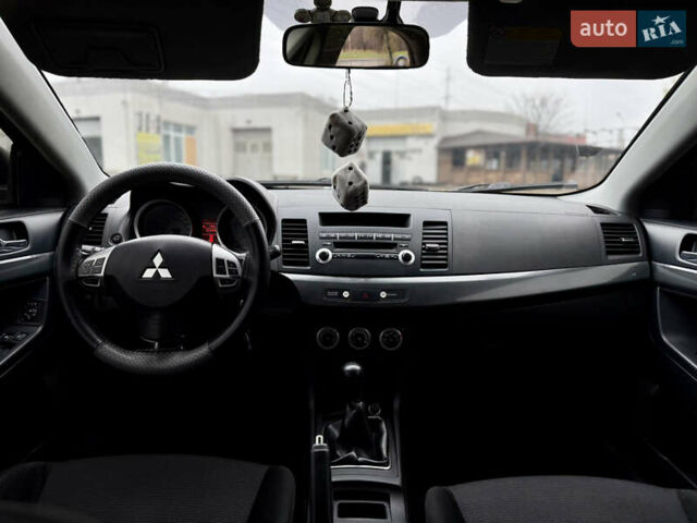 Черный Мицубиси Лансер, объемом двигателя 2 л и пробегом 215 тыс. км за 5500 $, фото 12 на Automoto.ua