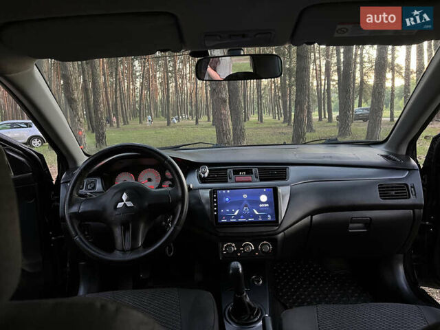 Чорний Міцубісі Lancer, об'ємом двигуна 1.58 л та пробігом 224 тис. км за 3900 $, фото 5 на Automoto.ua