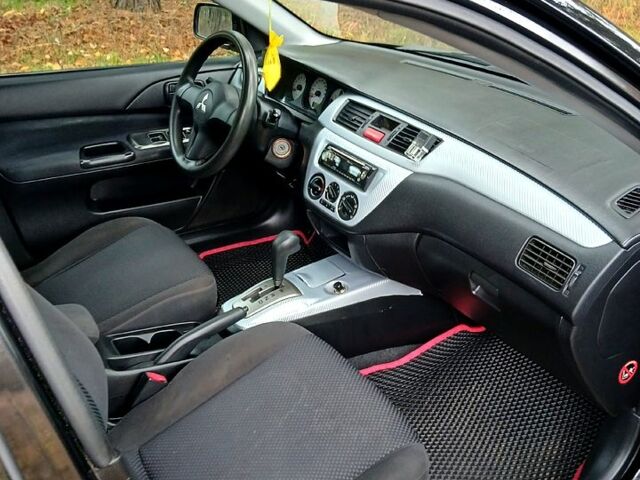 Чорний Міцубісі Lancer, об'ємом двигуна 1.6 л та пробігом 240 тис. км за 4700 $, фото 9 на Automoto.ua