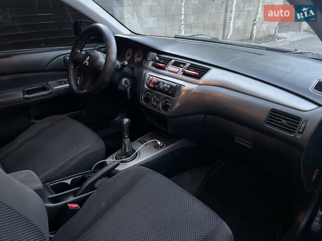 Чорний Міцубісі Lancer, об'ємом двигуна 1.58 л та пробігом 278 тис. км за 4800 $, фото 8 на Automoto.ua