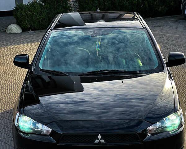 Черный Мицубиси Лансер, объемом двигателя 2 л и пробегом 333 тыс. км за 7300 $, фото 12 на Automoto.ua