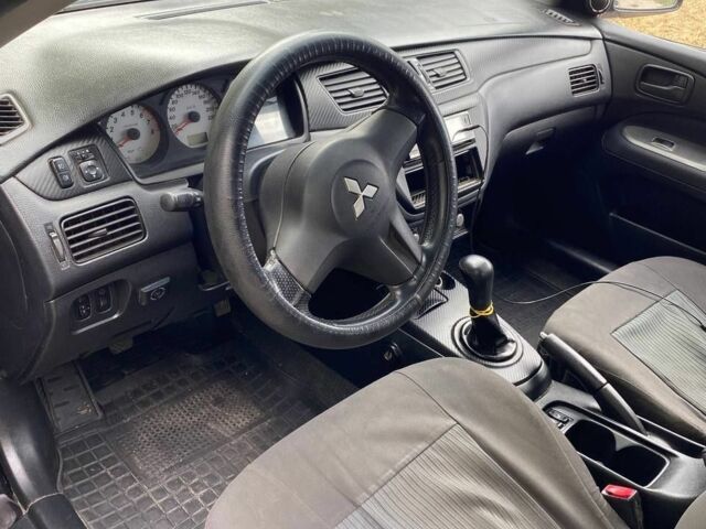 Чорний Міцубісі Lancer, об'ємом двигуна 1.6 л та пробігом 232 тис. км за 4200 $, фото 5 на Automoto.ua