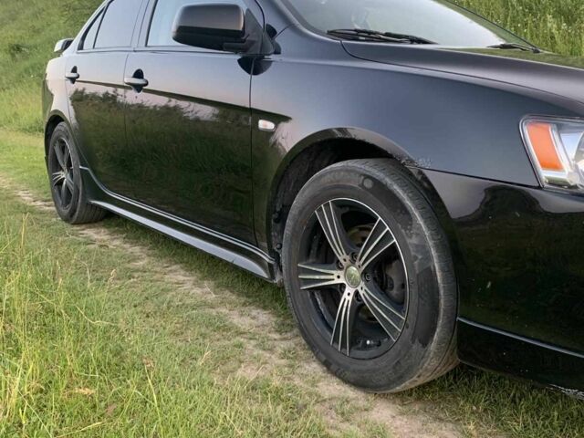 Черный Мицубиси Лансер, объемом двигателя 2 л и пробегом 208 тыс. км за 4300 $, фото 3 на Automoto.ua