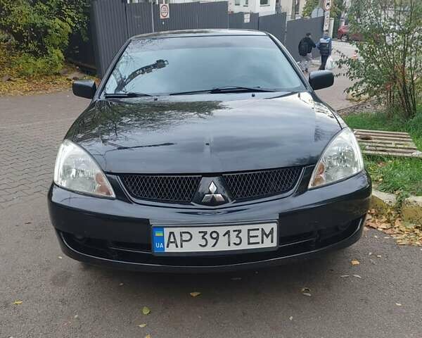 Чорний Міцубісі Lancer, об'ємом двигуна 1.58 л та пробігом 190 тис. км за 3750 $, фото 17 на Automoto.ua