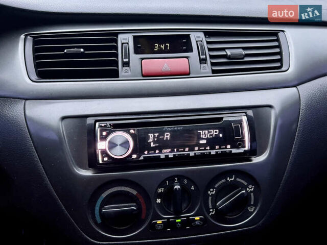 Чорний Міцубісі Lancer, об'ємом двигуна 1.6 л та пробігом 303 тис. км за 4350 $, фото 27 на Automoto.ua