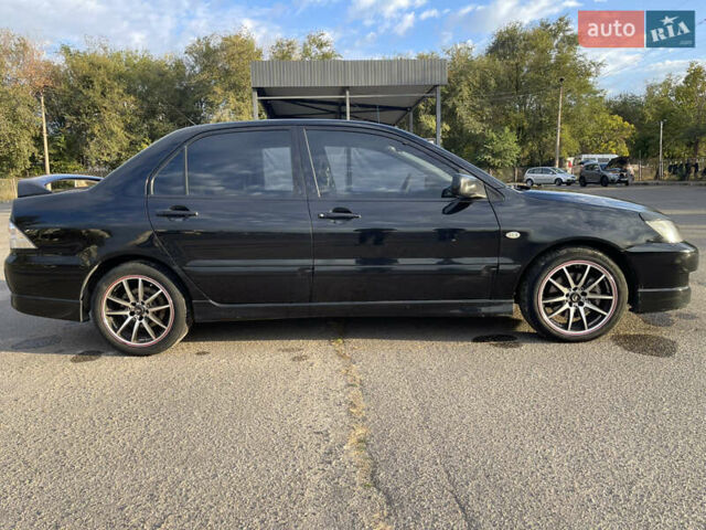 Чорний Міцубісі Lancer, об'ємом двигуна 2 л та пробігом 280 тис. км за 4600 $, фото 14 на Automoto.ua