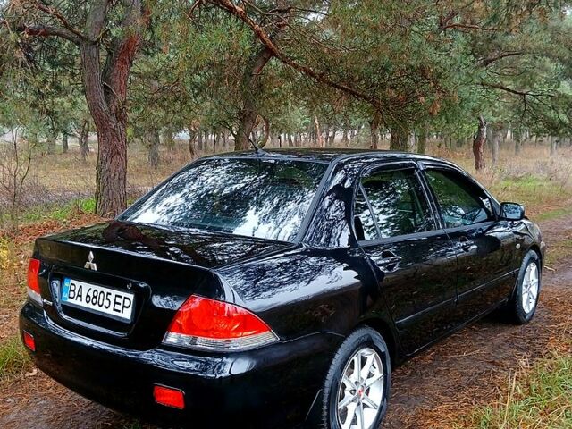 Чорний Міцубісі Lancer, об'ємом двигуна 1.6 л та пробігом 240 тис. км за 4700 $, фото 5 на Automoto.ua