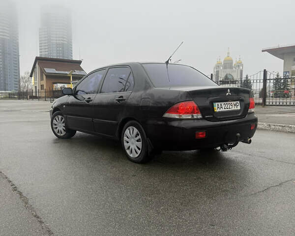 Чорний Міцубісі Lancer, об'ємом двигуна 1.58 л та пробігом 256 тис. км за 3700 $, фото 3 на Automoto.ua