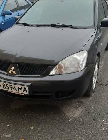 Черный Мицубиси Лансер, объемом двигателя 1.6 л и пробегом 215 тыс. км за 3900 $, фото 2 на Automoto.ua