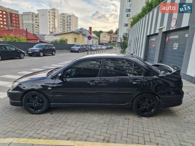 Чорний Міцубісі Lancer, об'ємом двигуна 2 л та пробігом 272 тис. км за 4750 $, фото 13 на Automoto.ua
