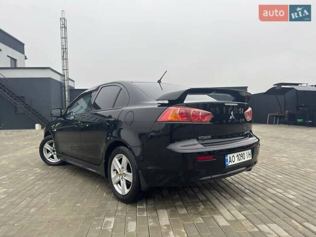 Черный Мицубиси Лансер, объемом двигателя 2 л и пробегом 259 тыс. км за 6500 $, фото 3 на Automoto.ua