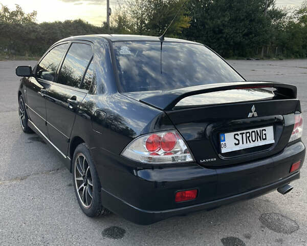 Чорний Міцубісі Lancer, об'ємом двигуна 2 л та пробігом 280 тис. км за 4600 $, фото 16 на Automoto.ua