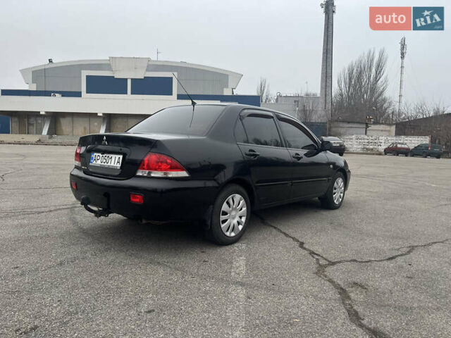 Чорний Міцубісі Lancer, об'ємом двигуна 1.58 л та пробігом 173 тис. км за 5099 $, фото 3 на Automoto.ua