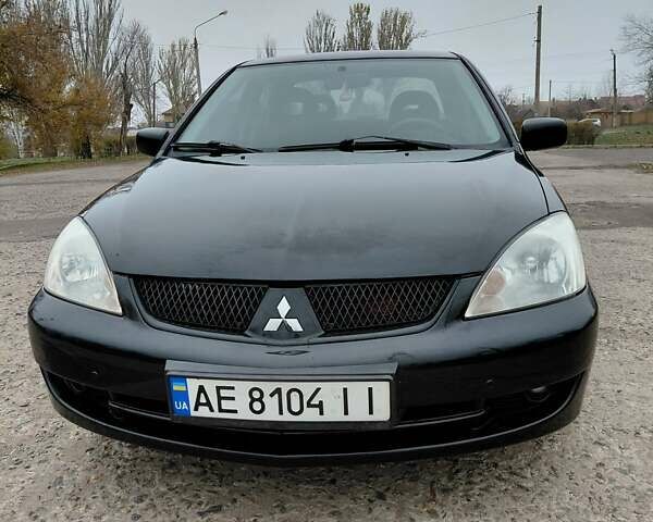 Чорний Міцубісі Lancer, об'ємом двигуна 1.58 л та пробігом 201 тис. км за 4500 $, фото 4 на Automoto.ua