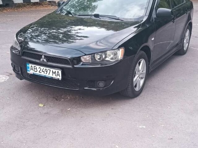 Черный Мицубиси Лансер, объемом двигателя 2 л и пробегом 210 тыс. км за 6000 $, фото 3 на Automoto.ua